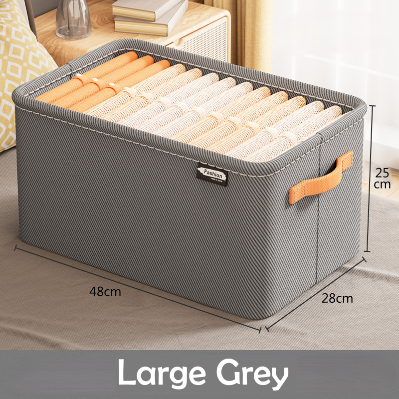 A clothing box organizer in a khaki color with visible side handles and a fabric build.