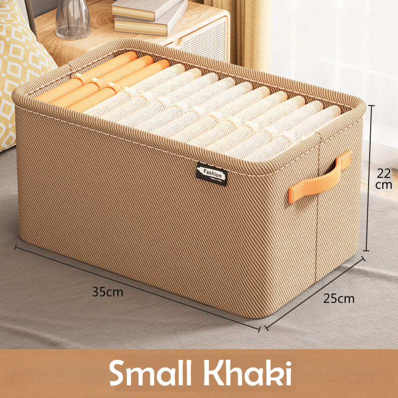 A clothing box organizer in a khaki color with visible side handles and a fabric build.