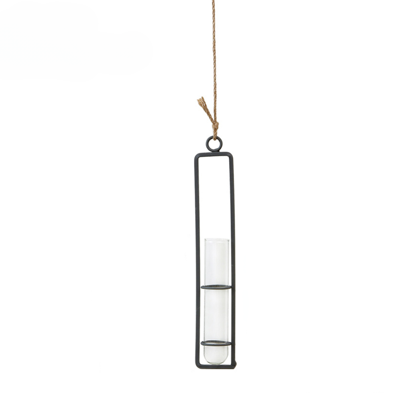 Hanging candle holder with glass container on a white background