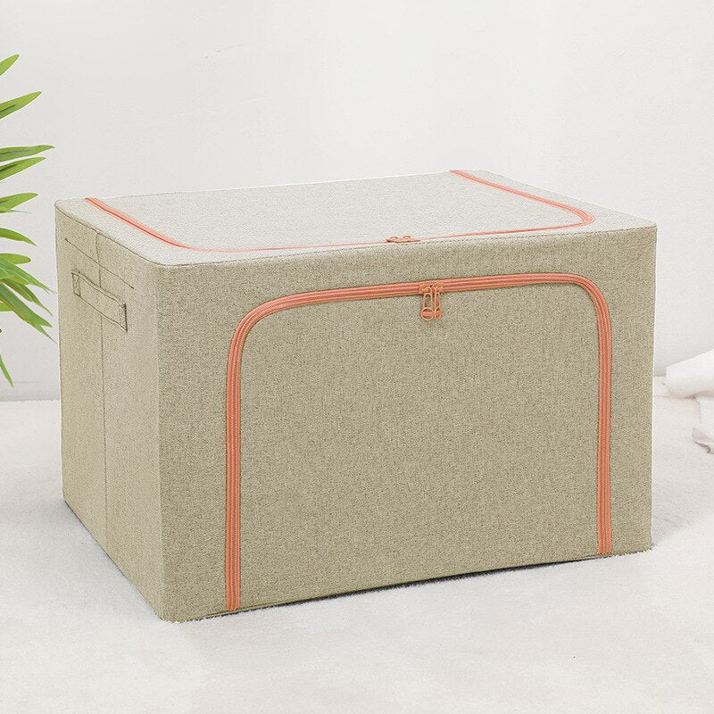 Foldable storage boxes in gray color with a side window, containing neatly folded multicolored items. The upper box is closed with a zipper, and the lower one is open, showing the items inside.
