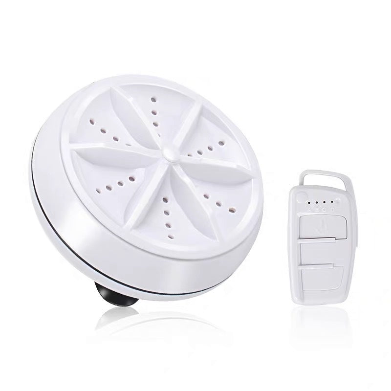A compact white ultrasonic cleaner device with a star-shaped top and a small white remote control.
