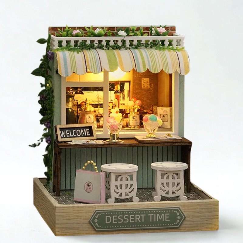 Miniature model of a dessert stand with decorative elements on a white background