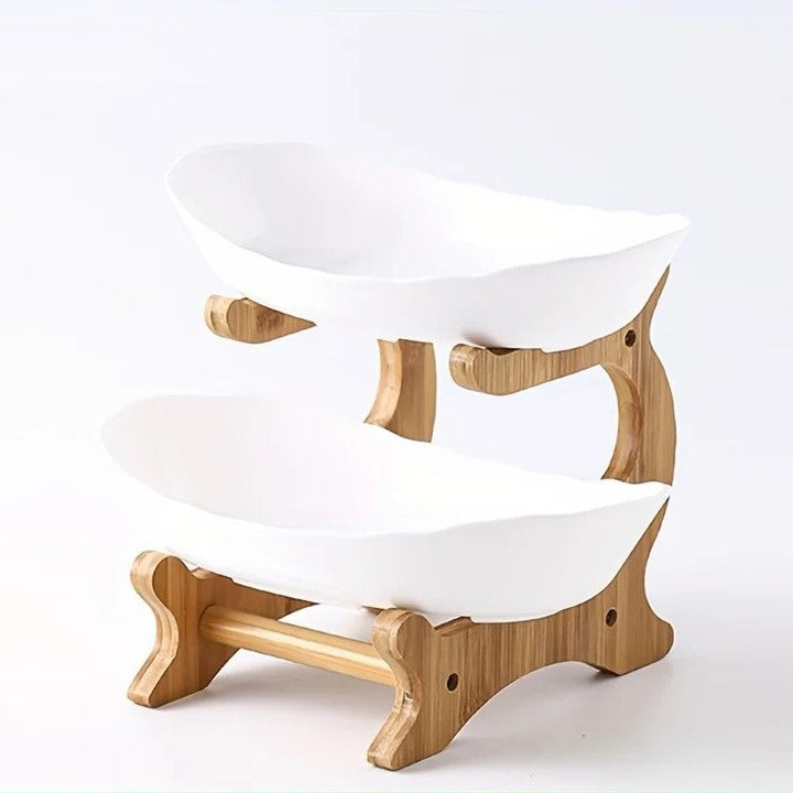 A set of multi-tiered snack bowls with a wood stand, available in beige, white, and turquoise colors, filled with various fruits.