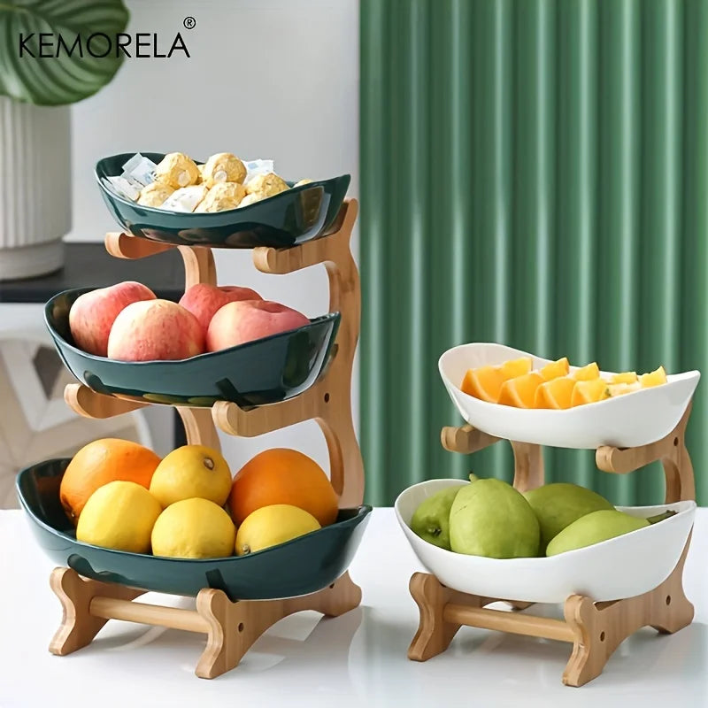 A set of multi-tiered snack bowls with a wood stand, available in beige, white, and turquoise colors, filled with various fruits.