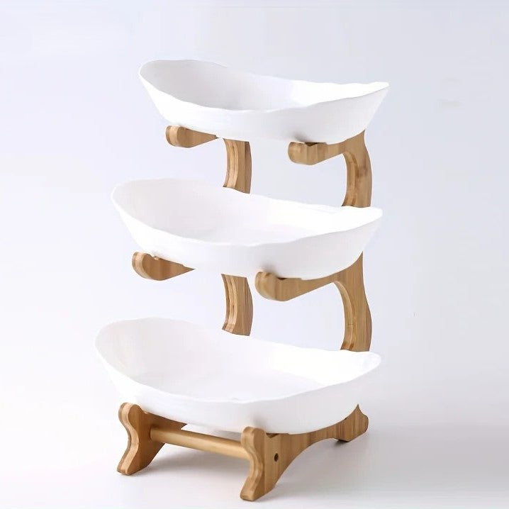 A set of multi-tiered snack bowls with a wood stand, available in beige, white, and turquoise colors, filled with various fruits.
