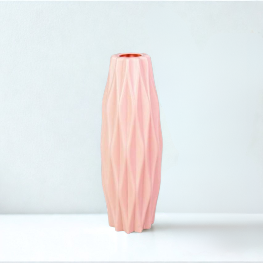 Pink textured vase on a white background