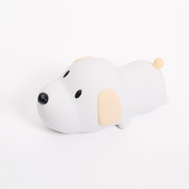 A silicone puppy-shaped nightlight in white color with a minimalistic design, featuring different light settings.