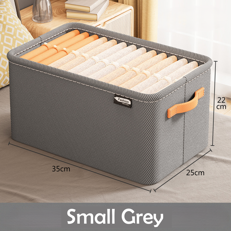 A clothing box organizer in a khaki color with visible side handles and a fabric build.