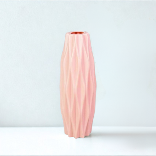 Pink textured vase on a white background