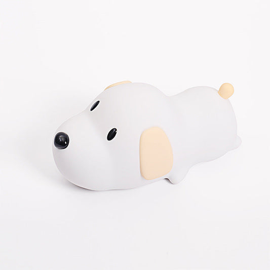 A silicone puppy-shaped nightlight in white color with a minimalistic design, featuring different light settings.